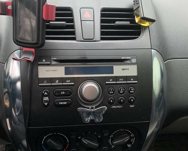 Оранжевый Сузуки СХ4, объемом двигателя 1.59 л и пробегом 105 тыс. км за 9200 $, фото 16 на Automoto.ua