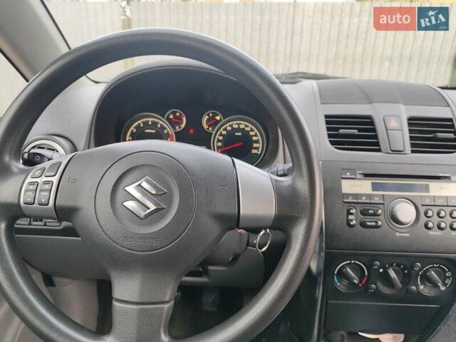 Оранжевый Сузуки СХ4, объемом двигателя 1.59 л и пробегом 92 тыс. км за 7000 $, фото 3 на Automoto.ua