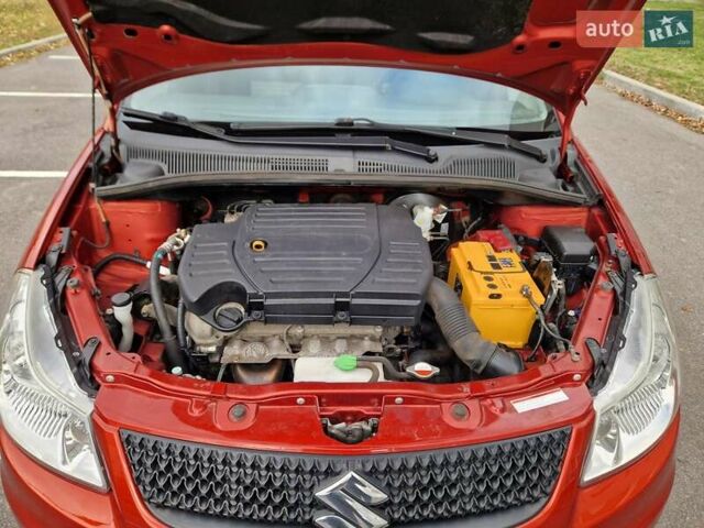 Помаранчевий Сузукі СХ4, об'ємом двигуна 1.6 л та пробігом 88 тис. км за 11200 $, фото 82 на Automoto.ua