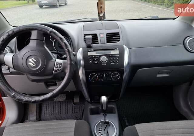 Оранжевый Сузуки СХ4, объемом двигателя 1.6 л и пробегом 85 тыс. км за 11200 $, фото 4 на Automoto.ua