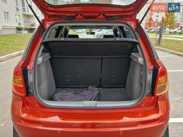 Помаранчевий Сузукі СХ4, об'ємом двигуна 1.6 л та пробігом 88 тис. км за 11200 $, фото 81 на Automoto.ua