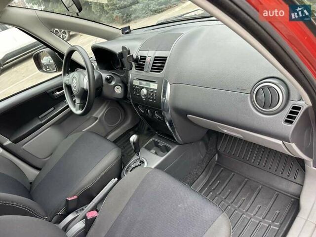 Оранжевый Сузуки СХ4, объемом двигателя 1.59 л и пробегом 136 тыс. км за 9900 $, фото 6 на Automoto.ua