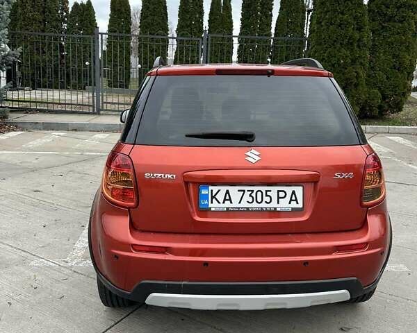 Оранжевый Сузуки СХ4, объемом двигателя 1.59 л и пробегом 136 тыс. км за 9900 $, фото 3 на Automoto.ua