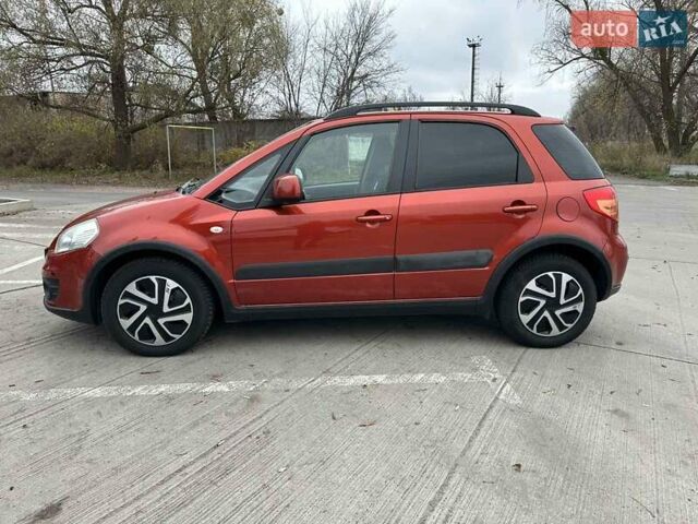 Оранжевый Сузуки СХ4, объемом двигателя 1.59 л и пробегом 136 тыс. км за 9900 $, фото 4 на Automoto.ua