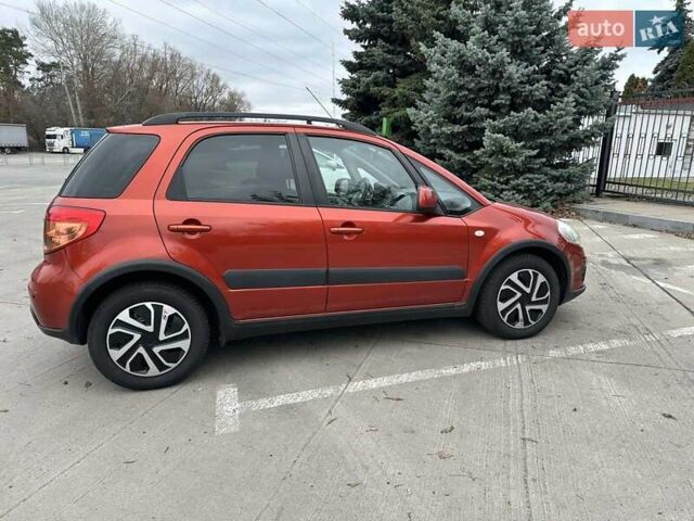 Оранжевый Сузуки СХ4, объемом двигателя 1.59 л и пробегом 136 тыс. км за 9900 $, фото 2 на Automoto.ua