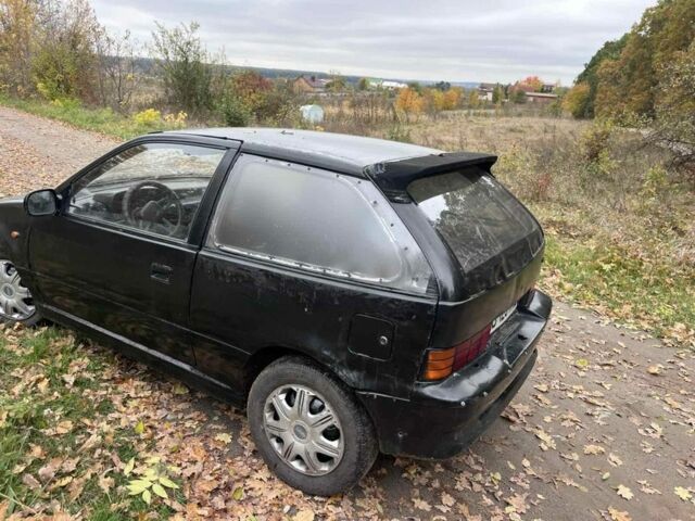 Чорний Сузукі Свифт, об'ємом двигуна 1.3 л та пробігом 320 тис. км за 500 $, фото 2 на Automoto.ua