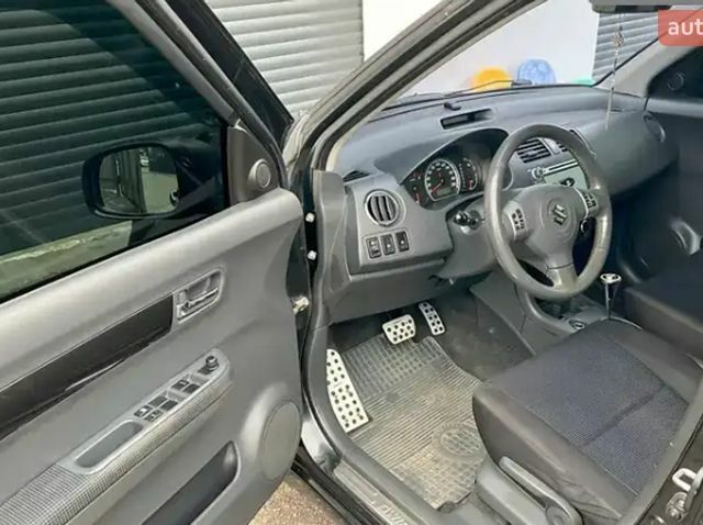 Чорний Сузукі Свифт, об'ємом двигуна 1.49 л та пробігом 142 тис. км за 6500 $, фото 15 на Automoto.ua