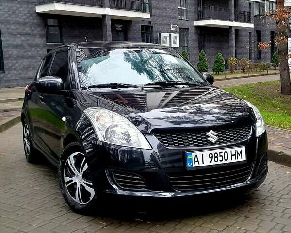 Черный Сузуки Свифт, объемом двигателя 1.25 л и пробегом 126 тыс. км за 8399 $, фото 1 на Automoto.ua