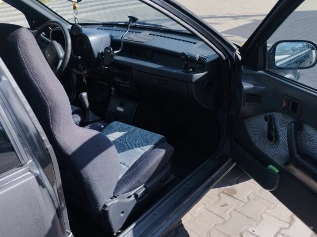 Чорний Сузукі Свифт, об'ємом двигуна 1.3 л та пробігом 80 тис. км за 1300 $, фото 2 на Automoto.ua