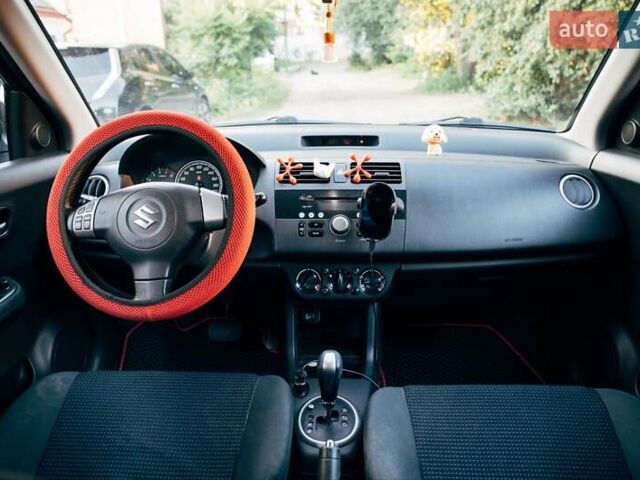 Червоний Сузукі Свифт, об'ємом двигуна 1.33 л та пробігом 181 тис. км за 5999 $, фото 12 на Automoto.ua