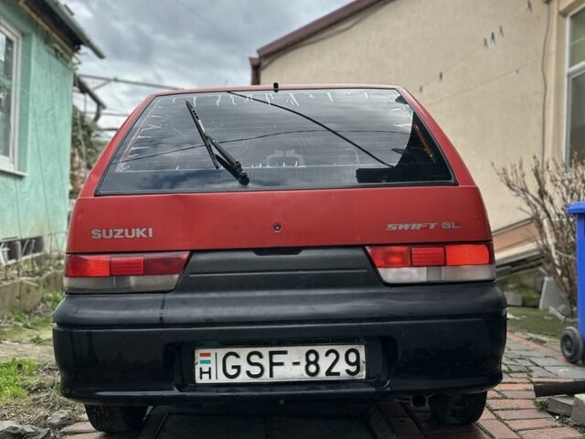 Красный Сузуки Свифт, объемом двигателя 1 л и пробегом 155 тыс. км за 750 $, фото 1 на Automoto.ua