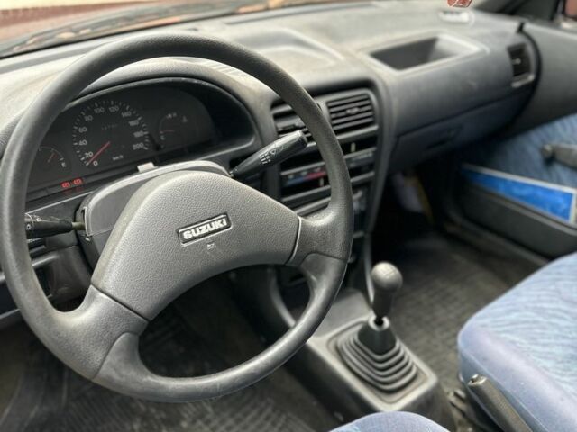 Красный Сузуки Свифт, объемом двигателя 1 л и пробегом 155 тыс. км за 750 $, фото 4 на Automoto.ua