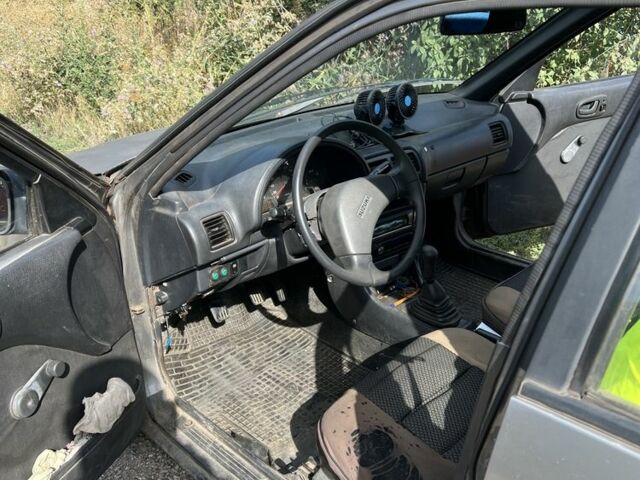 Сірий Сузукі Свифт, об'ємом двигуна 1.3 л та пробігом 220 тис. км за 680 $, фото 1 на Automoto.ua