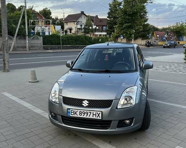 Сірий Сузукі Свифт, об'ємом двигуна 1.49 л та пробігом 143 тис. км за 8031 $, фото 5 на Automoto.ua