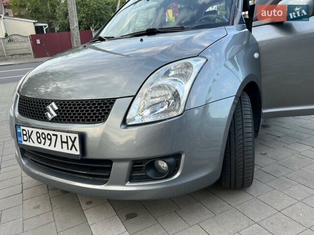 Сірий Сузукі Свифт, об'ємом двигуна 1.49 л та пробігом 143 тис. км за 8031 $, фото 18 на Automoto.ua