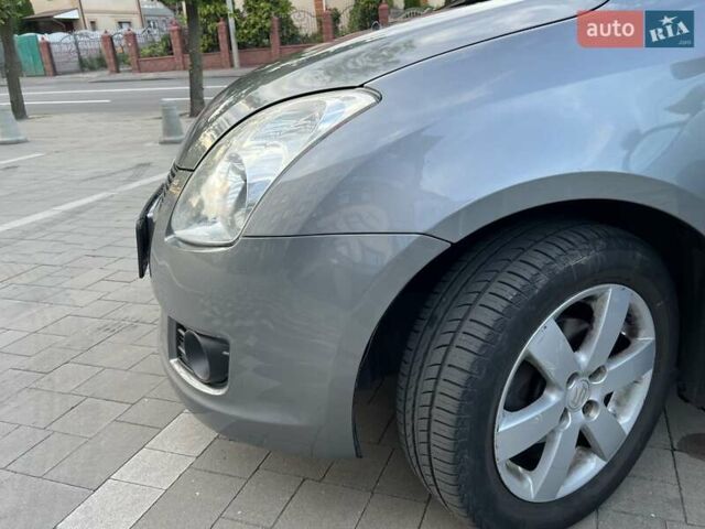 Сірий Сузукі Свифт, об'ємом двигуна 1.49 л та пробігом 143 тис. км за 8031 $, фото 25 на Automoto.ua