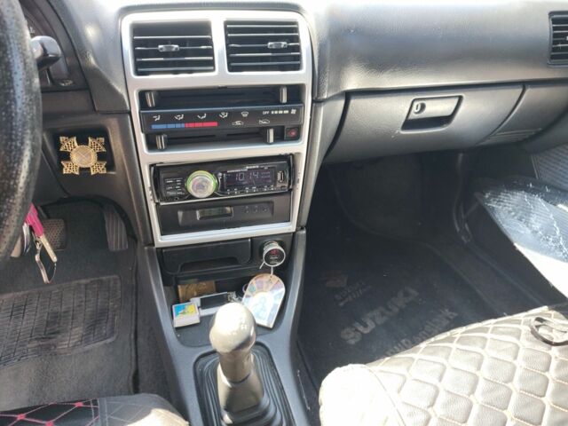 Сірий Сузукі Свифт, об'ємом двигуна 1.3 л та пробігом 350 тис. км за 1800 $, фото 5 на Automoto.ua