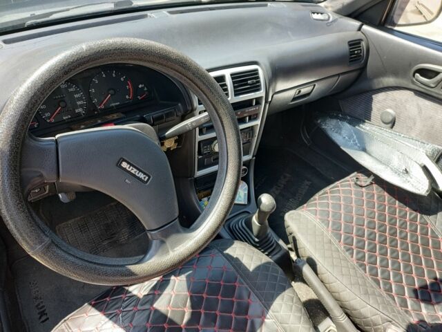 Сірий Сузукі Свифт, об'ємом двигуна 1.3 л та пробігом 350 тис. км за 1800 $, фото 4 на Automoto.ua