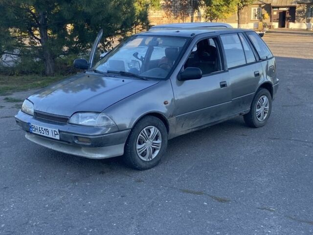 Серый Сузуки Свифт, объемом двигателя 1 л и пробегом 24 тыс. км за 900 $, фото 2 на Automoto.ua