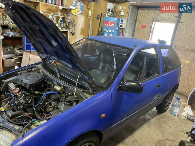 Синий Сузуки Свифт, объемом двигателя 1 л и пробегом 296 тыс. км за 1000 $, фото 5 на Automoto.ua