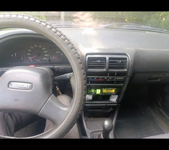 Синий Сузуки Свифт, объемом двигателя 1.3 л и пробегом 150 тыс. км за 834 $, фото 10 на Automoto.ua