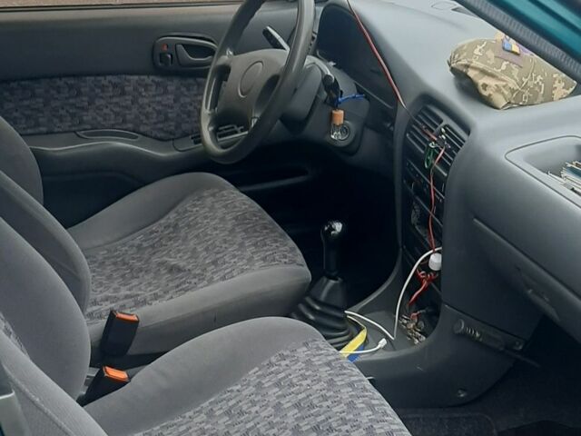 Зелений Сузукі Свифт, об'ємом двигуна 1.3 л та пробігом 230 тис. км за 1800 $, фото 4 на Automoto.ua