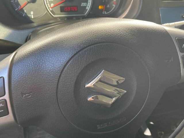 Помаранчевий Сузукі Свифт, об'ємом двигуна 1.3 л та пробігом 159 тис. км за 4500 $, фото 6 на Automoto.ua