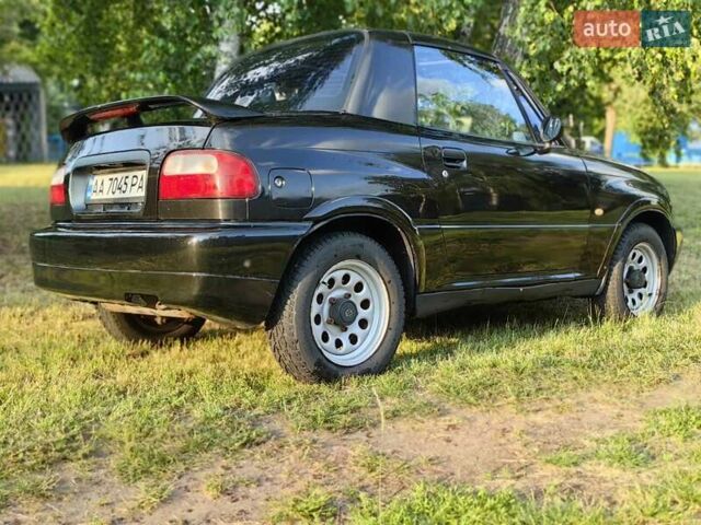 Черный Сузуки Витара, объемом двигателя 1.6 л и пробегом 185 тыс. км за 5500 $, фото 25 на Automoto.ua