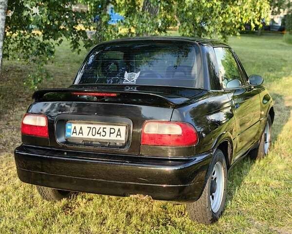 Черный Сузуки Витара, объемом двигателя 1.6 л и пробегом 185 тыс. км за 5500 $, фото 2 на Automoto.ua