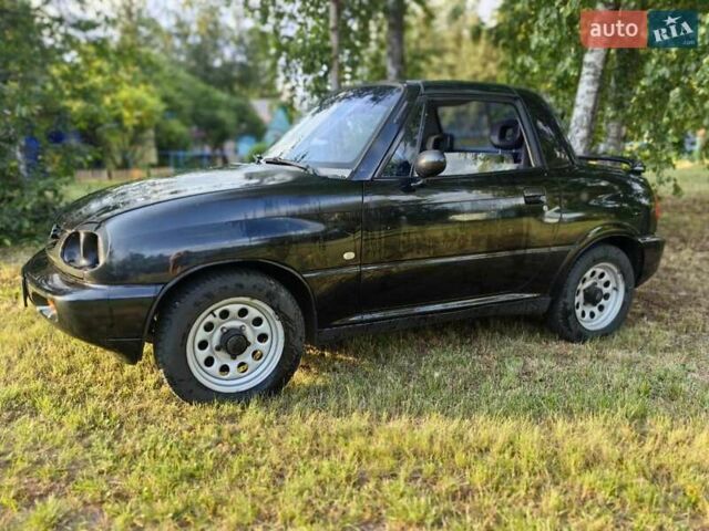 Черный Сузуки Витара, объемом двигателя 1.6 л и пробегом 185 тыс. км за 5500 $, фото 24 на Automoto.ua