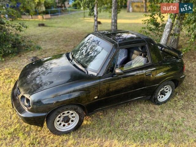 Черный Сузуки Витара, объемом двигателя 1.6 л и пробегом 185 тыс. км за 5500 $, фото 22 на Automoto.ua