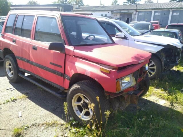 Красный Сузуки Sidekick, объемом двигателя 1.6 л и пробегом 284 тыс. км за 2000 $, фото 2 на Automoto.ua