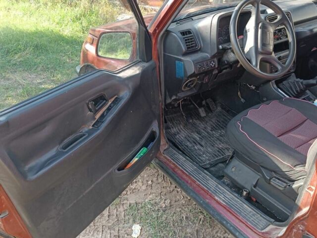 Червоний Сузукі Sidekick, об'ємом двигуна 1.6 л та пробігом 300 тис. км за 3000 $, фото 5 на Automoto.ua