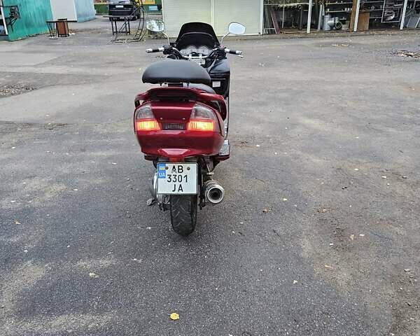 Красный Сузуки Skywave 250, объемом двигателя 0.25 л и пробегом 29 тыс. км за 1800 $, фото 2 на Automoto.ua