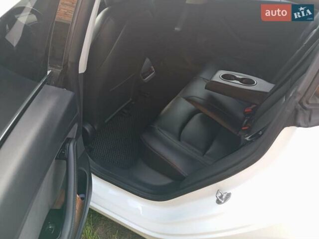 Белый Тесла Модель 3, объемом двигателя 0 л и пробегом 128 тыс. км за 16000 $, фото 1 на Automoto.ua