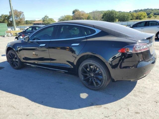 Черный Тесла Модель С, объемом двигателя 0 л и пробегом 148 тыс. км за 9900 $, фото 1 на Automoto.ua