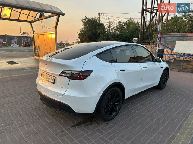 Білий Тесла Model Y, об'ємом двигуна 0 л та пробігом 63 тис. км за 34999 $, фото 6 на Automoto.ua