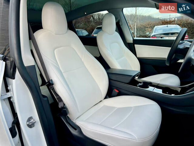 Белый Тесла Model Y, объемом двигателя 0 л и пробегом 57 тыс. км за 28500 $, фото 35 на Automoto.ua