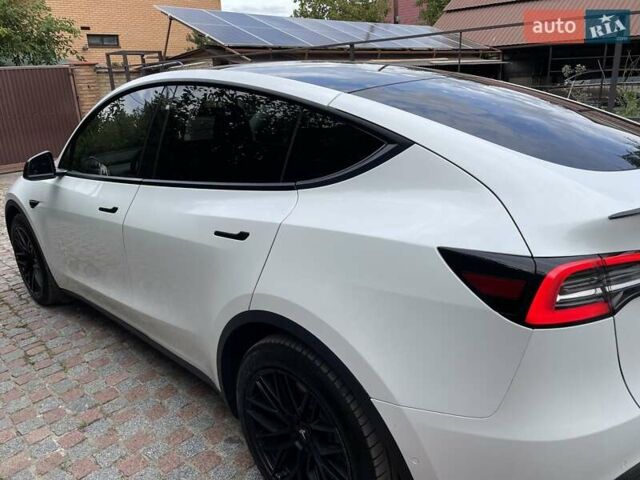 Білий Тесла Model Y, об'ємом двигуна 0 л та пробігом 79 тис. км за 25300 $, фото 2 на Automoto.ua