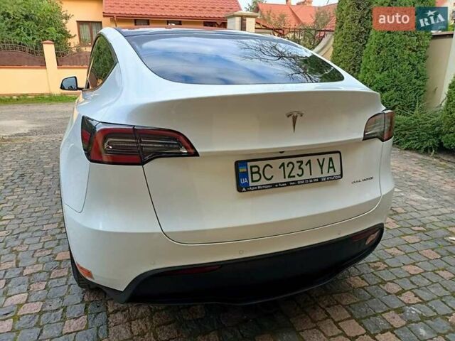 Білий Тесла Model Y, об'ємом двигуна 0 л та пробігом 65 тис. км за 28000 $, фото 18 на Automoto.ua