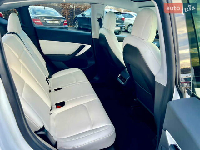 Белый Тесла Model Y, объемом двигателя 0 л и пробегом 57 тыс. км за 28500 $, фото 32 на Automoto.ua