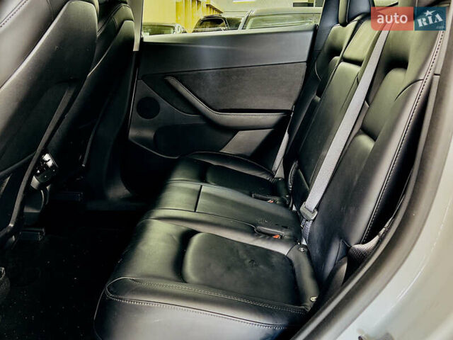 Білий Тесла Model Y, об'ємом двигуна 0 л та пробігом 74 тис. км за 24979 $, фото 11 на Automoto.ua