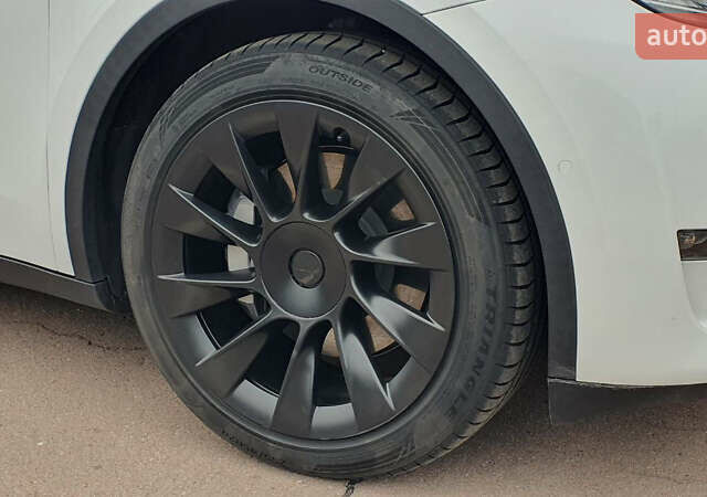 Білий Тесла Model Y, об'ємом двигуна 0 л та пробігом 74 тис. км за 25900 $, фото 17 на Automoto.ua