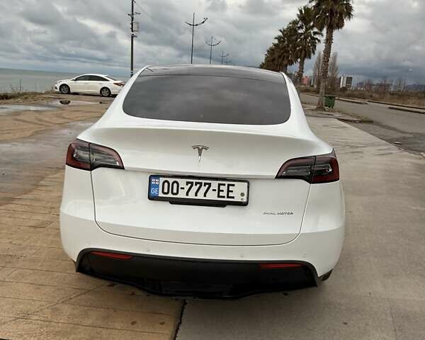 Белый Тесла Model Y, объемом двигателя 0 л и пробегом 58 тыс. км за 23000 $, фото 1 на Automoto.ua