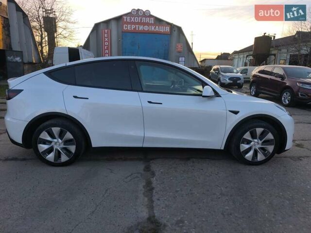Білий Тесла Model Y, об'ємом двигуна 0 л та пробігом 86 тис. км за 25300 $, фото 2 на Automoto.ua