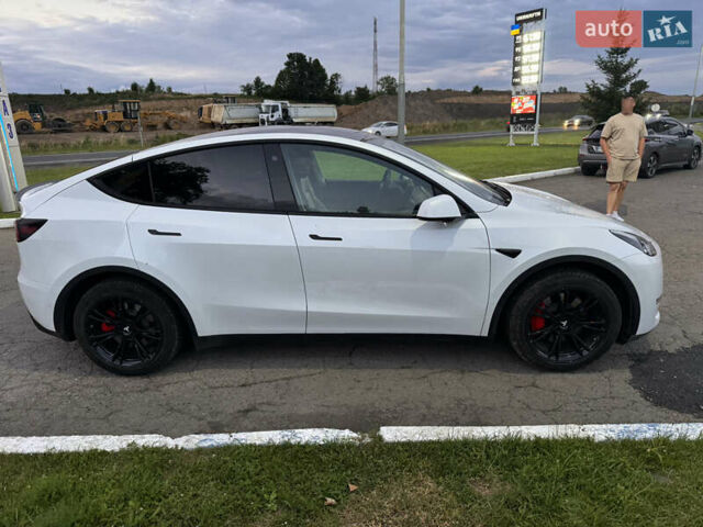 Белый Тесла Model Y, объемом двигателя 0 л и пробегом 79 тыс. км за 27899 $, фото 2 на Automoto.ua