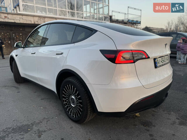 Білий Тесла Model Y, об'ємом двигуна 0 л та пробігом 55 тис. км за 24990 $, фото 2 на Automoto.ua