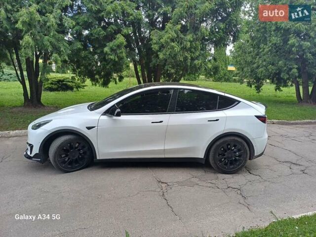 Белый Тесла Model Y, объемом двигателя 0 л и пробегом 67 тыс. км за 23000 $, фото 2 на Automoto.ua