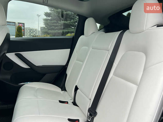 Білий Тесла Model Y, об'ємом двигуна 0 л та пробігом 88 тис. км за 26800 $, фото 18 на Automoto.ua