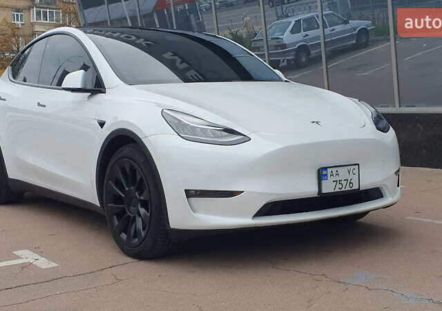 Білий Тесла Model Y, об'ємом двигуна 0 л та пробігом 74 тис. км за 25900 $, фото 1 на Automoto.ua